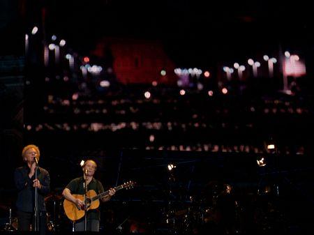 the boys again... on the screen is a picture looking out at the huge audience filling the road in front of the colosseum