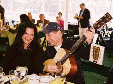 Catherine Shaffer and Paul Simon with his auctioned guitar.